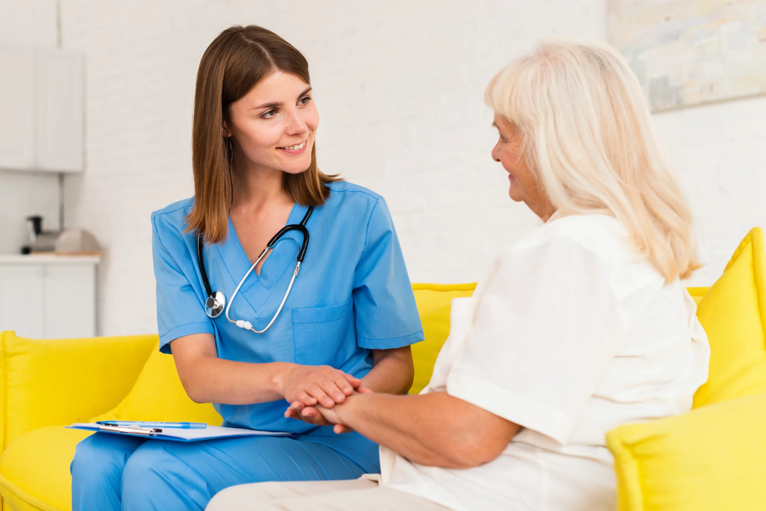 medium-shot-caregiver-old-woman-holding-hands